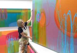 Photograph of Charlotte Cornish painting